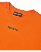 Orange cropped tee with green Jägermeister logo.