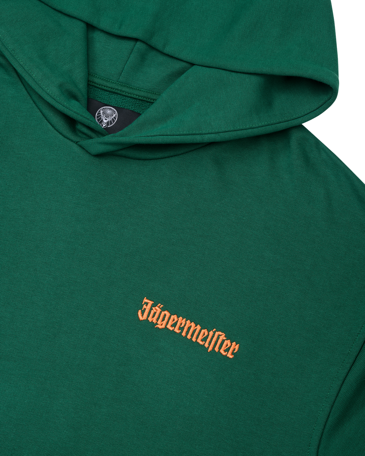 Green hoodie with an orange Jägermeister logo on the chest.