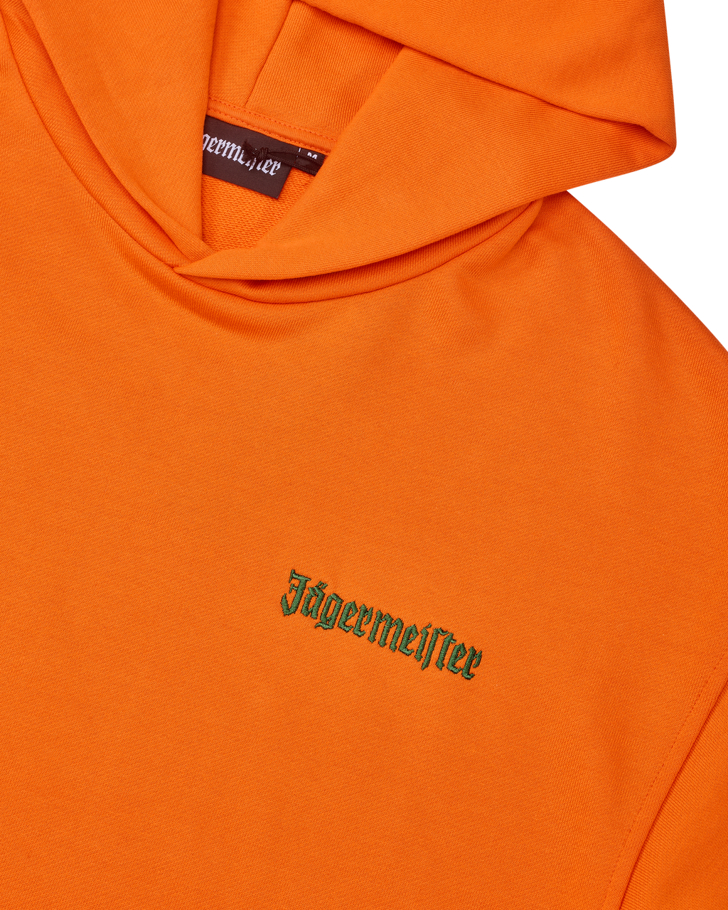 Orange hoodie with green Jägermeister wordmark on the chest.
