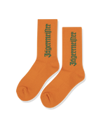 Șosete portocalii cu wordmark-ul Jägermeister verde.