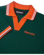 Green polo dress with orange collar and trim featuring Jägermeister branding.