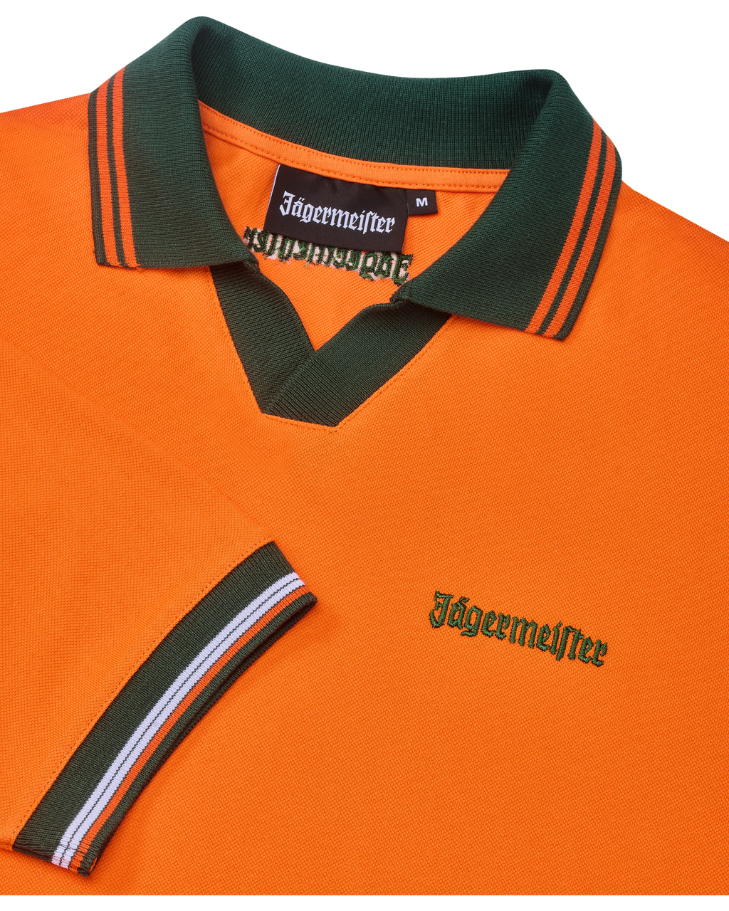 Orange Jägermeister polo shirt with green collar and orange trim featuring green Jägermeister branding.