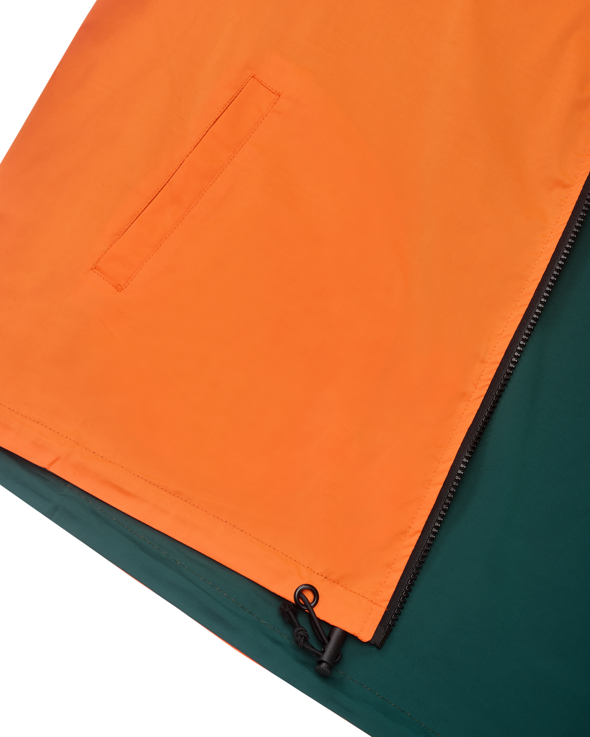 Close-up of an orange and green jacket with a zipper