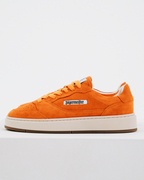 An orange Jägermeister sneaker with a thick cream platform sole and a white side label reading 'Jägermeister'.