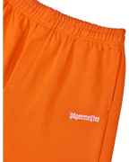 Orange track pants with white Jägermeister logo on the side.