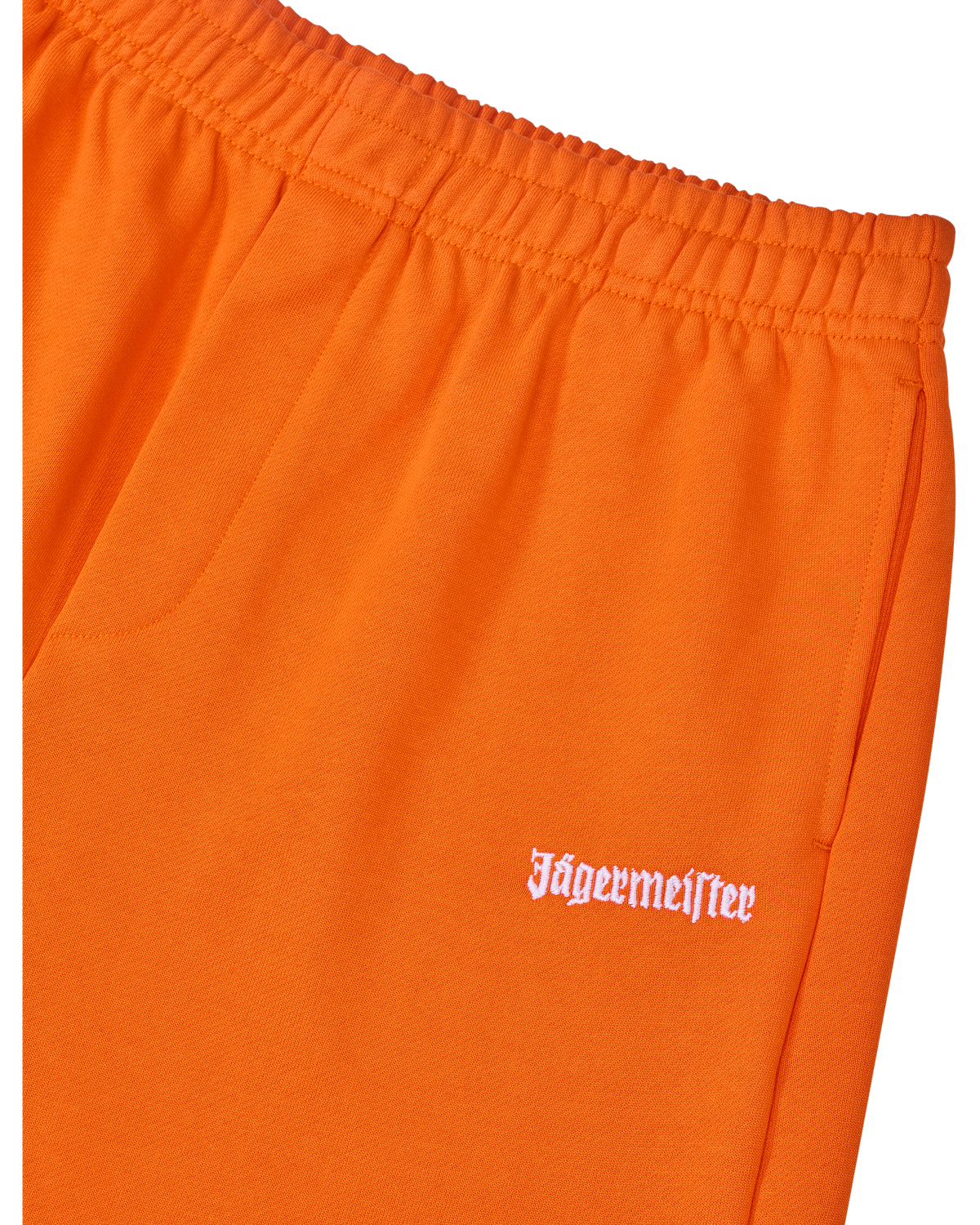 Orange track pants with white Jägermeister logo on the side.